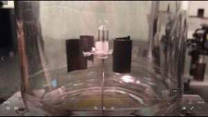 Video showing optical pulling of a Crookes radiometer with four-curved vanes driven by light